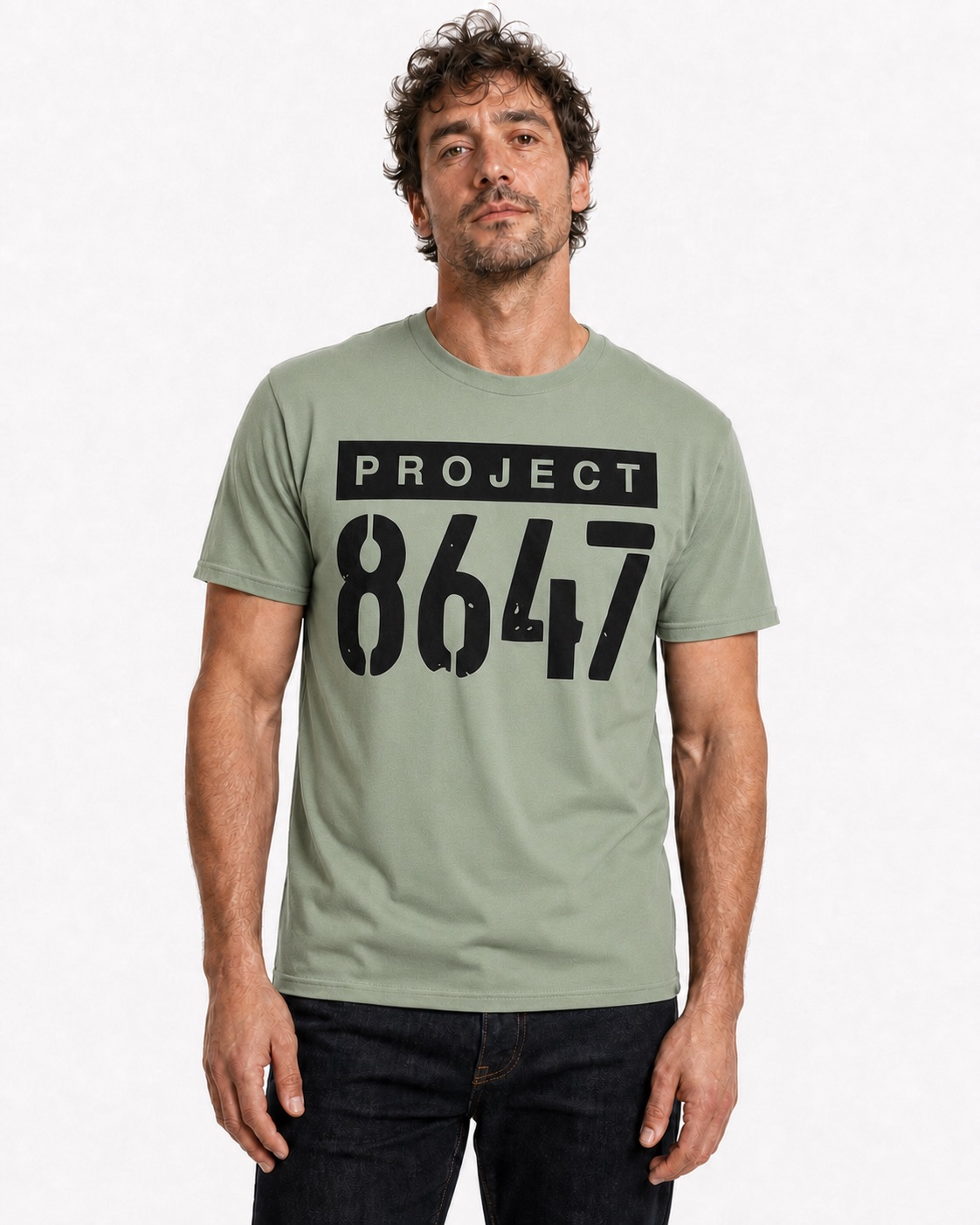 Man wearing the sage Project 8647 full-lockup T-shirt